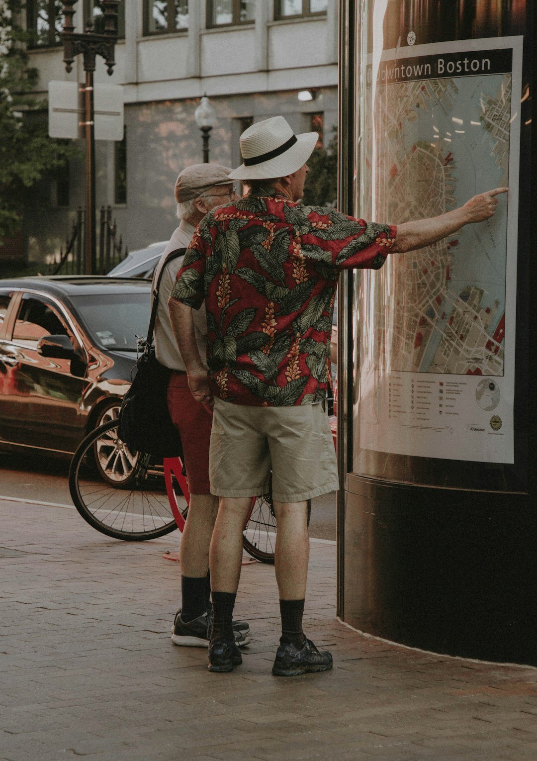 Senior couple looking at a map and planning a trip together